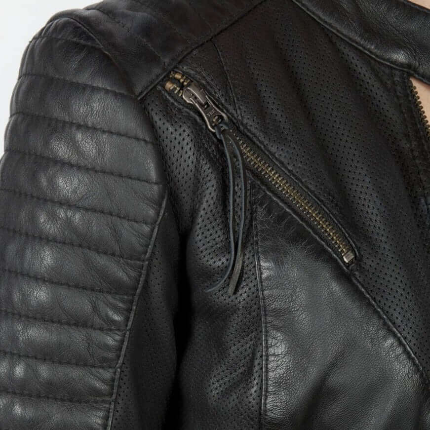 A closeup of the diagonal chest zipper on the Wild and Free leather motorcycle jacket