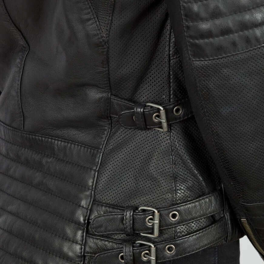 A closeup of the buckles and perforation on a black Wild and Free leather motorcycle jacket