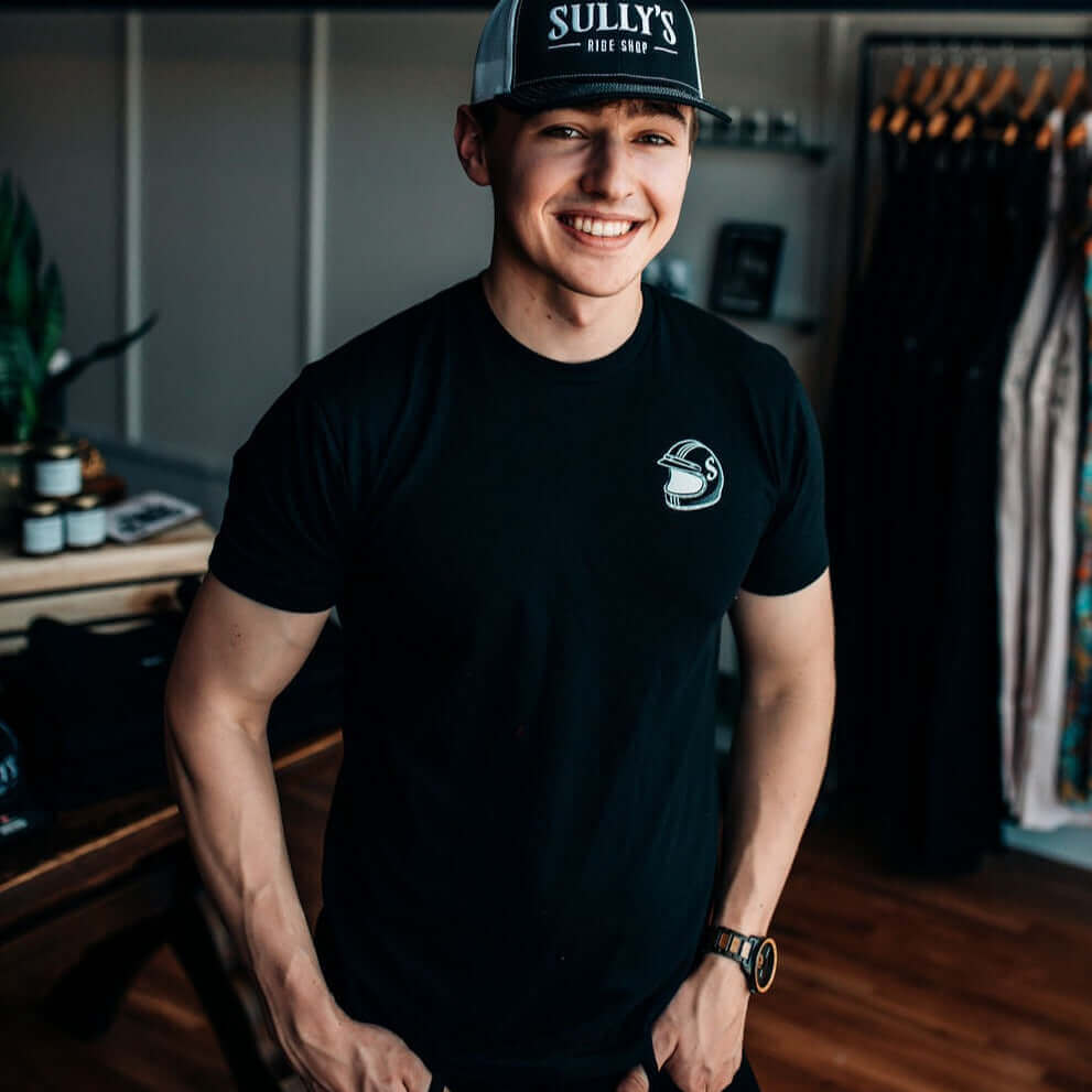 Sully's Tee on male model in retail store