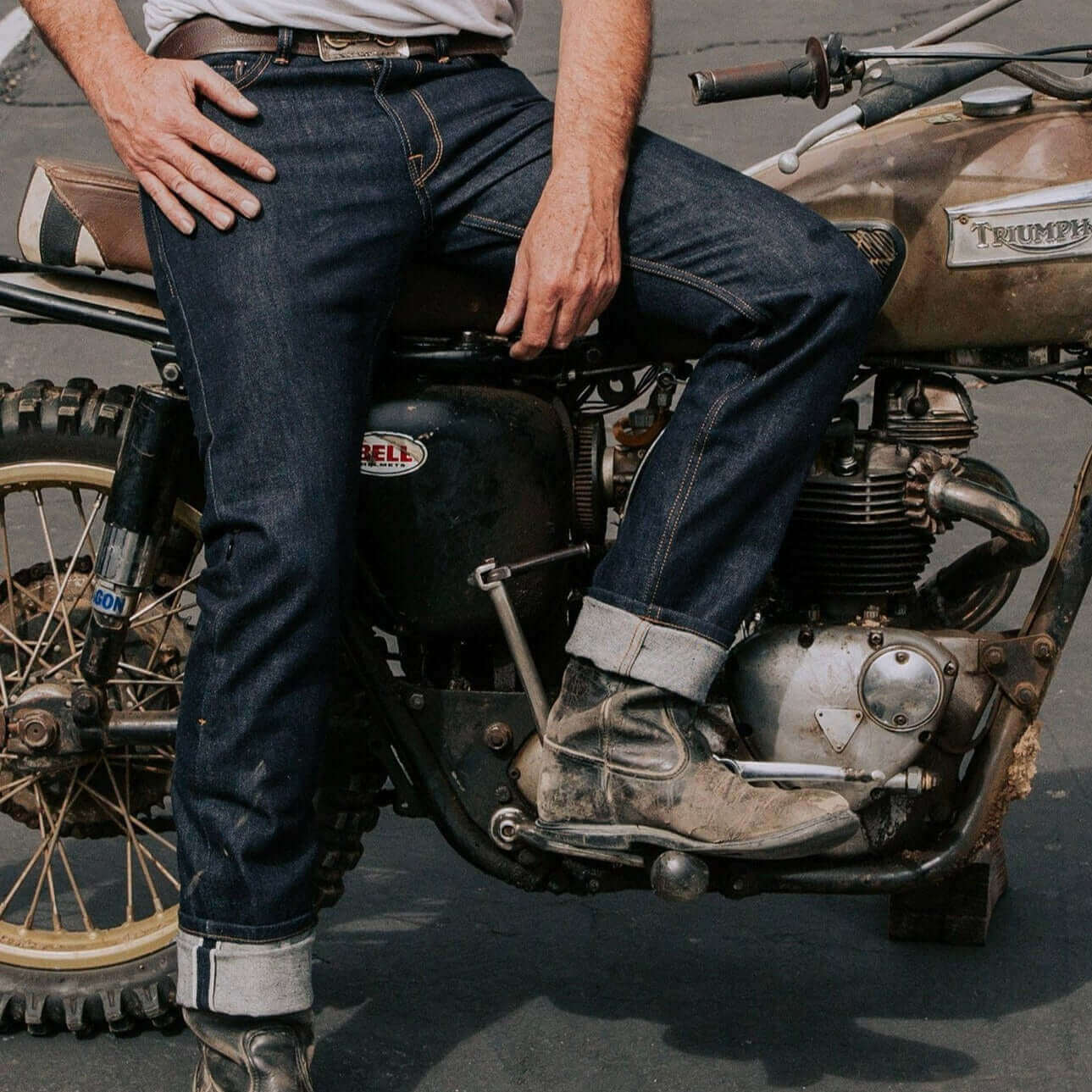 Tobacco Motorwear Ironsides Indigo Armored Jeans male model sitting on classic motorcycle