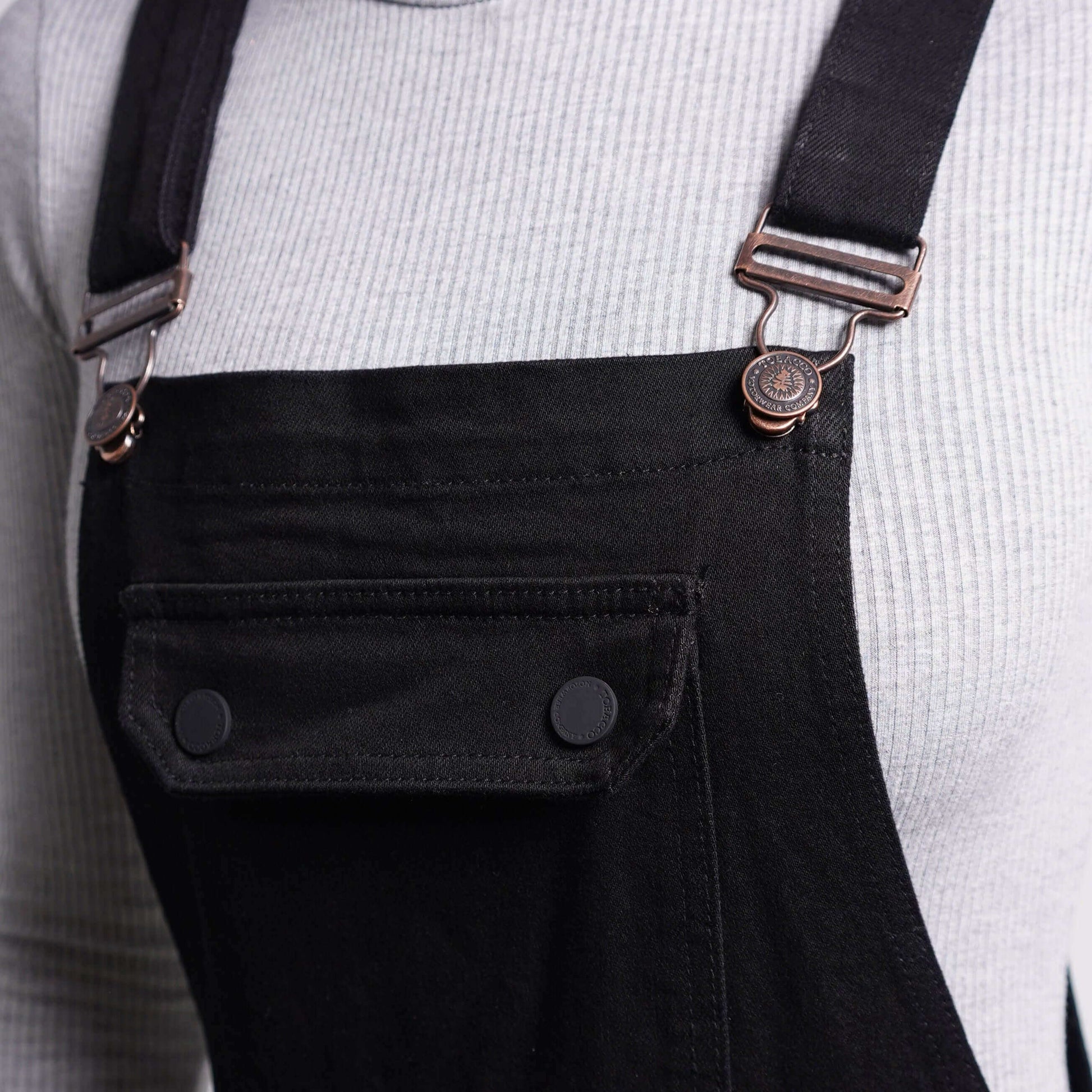 A close up of the chest pocket and buckles on Boondocks motorcycle riding overalls