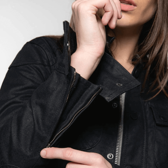 Tobacco Motorwear Women's McCoy Jacket Black female model adjusting sleeve